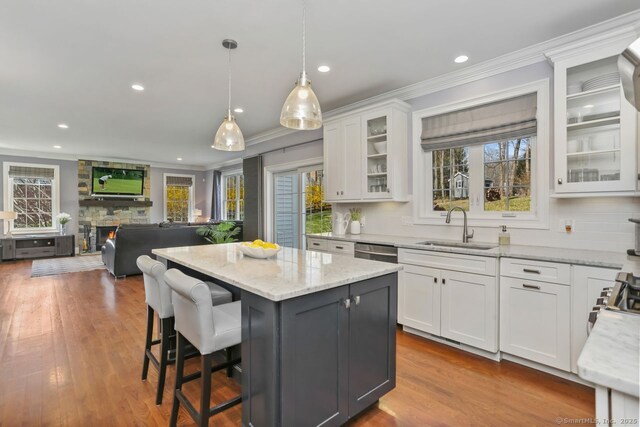 158 N Seir Hill Rd, Norwalk, CT 06850 - kitchen featuring white cabinets, crown molding, backsplash, and a sink