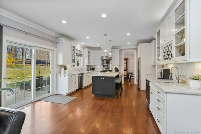 158 N Seir Hill Rd, Norwalk, CT 06850 - kitchen featuring white cabinetry, appliances with stainless steel finishes, a kitchen island, and a sink
