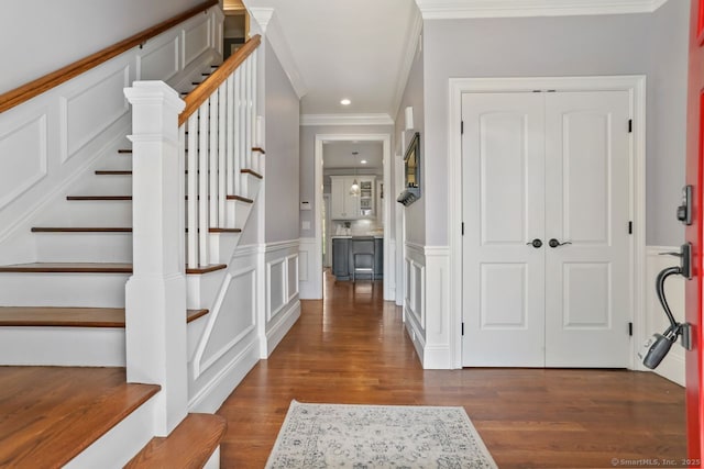 158 N Seir Hill Rd, Norwalk, CT 06850 - foyer with wainscoting, a decorative wall, crown molding, wood finished floors, and stairway