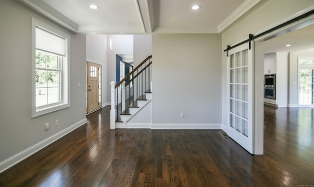 1481 Marion Rd, Cheshire, CT 06410 - entryway with dark wood finished floors, a barn door, ornamental molding, baseboards, and stairway