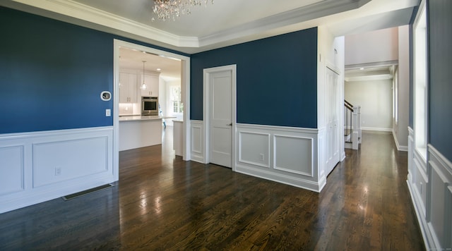 1481 Marion Rd, Cheshire, CT 06410 - spare room with a chandelier, a decorative wall, crown molding, wainscoting, and stairway