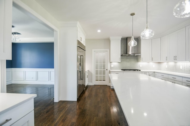 1481 Marion Rd, Cheshire, CT 06410 - kitchen with wall chimney exhaust hood, high quality fridge, light countertops, white cabinets, and recessed lighting