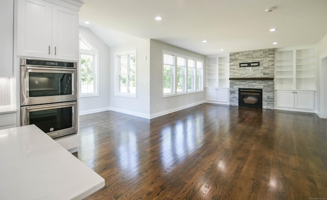 1481 Marion Rd, Cheshire, CT 06410 - unfurnished living room with plenty of natural light, dark wood-style flooring, a fireplace, baseboards, and recessed lighting