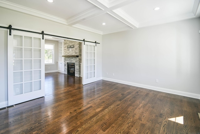 1481 Marion Rd, Cheshire, CT 06410 - unfurnished living room with a barn door, beam ceiling, baseboards, dark wood-type flooring, and ornamental molding