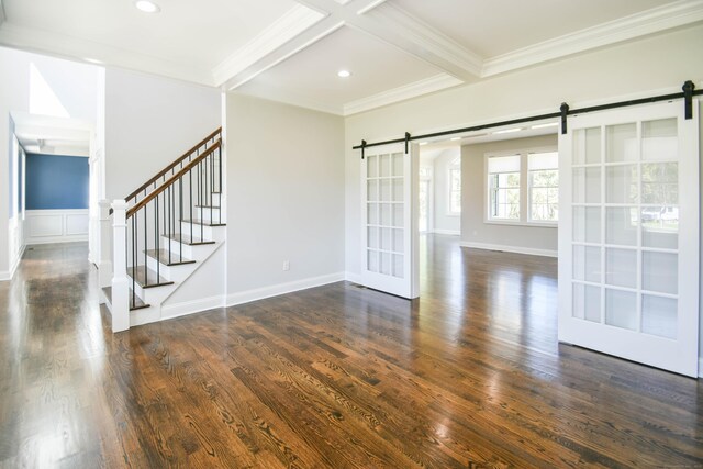 1481 Marion Rd, Cheshire, CT 06410 - unfurnished room with a barn door, beam ceiling, crown molding, dark wood-style floors, and stairway