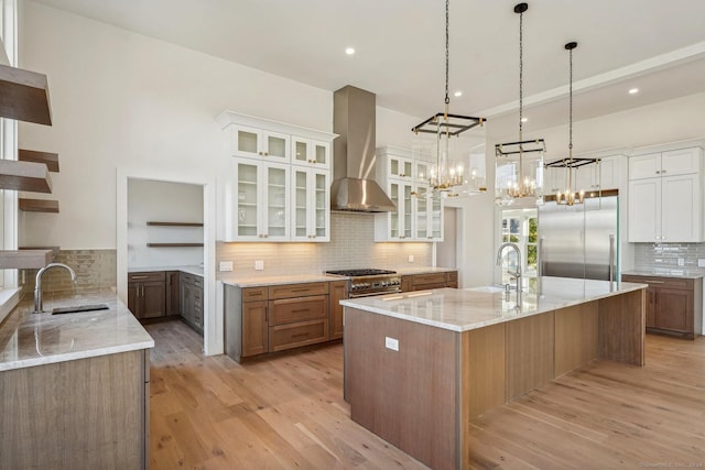 7 Egret Rd, Stonington, CT 06355 - kitchen with premium appliances, ventilation hood, decorative backsplash, white cabinets, and recessed lighting