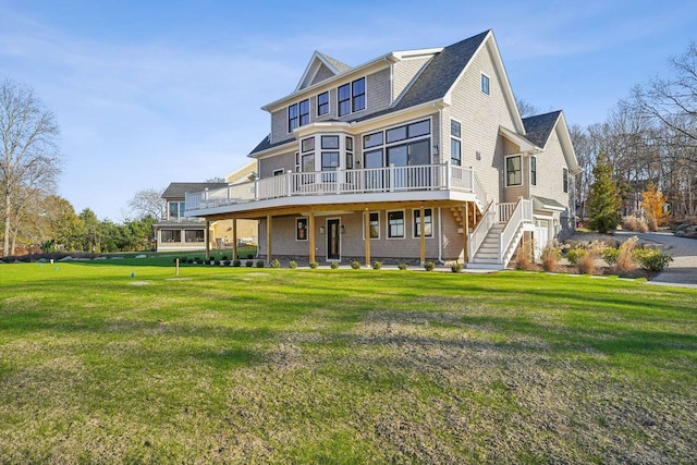 7 Egret Rd, Stonington, CT 06355 - back of property featuring a wooden deck, a yard, and stairs