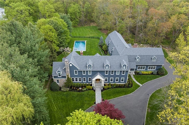 birds eye view of property with a forest view