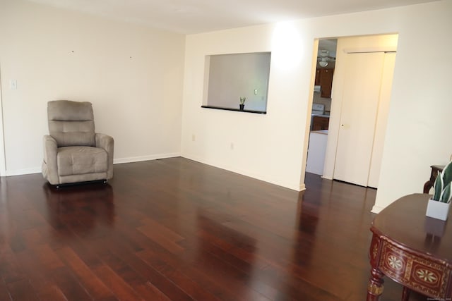 unfurnished room featuring wood finished floors and baseboards