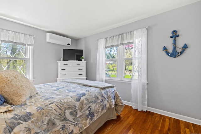 8 Dean Rd, East Lyme, CT 06333 - bedroom with an AC wall unit, wood finished floors, and baseboards
