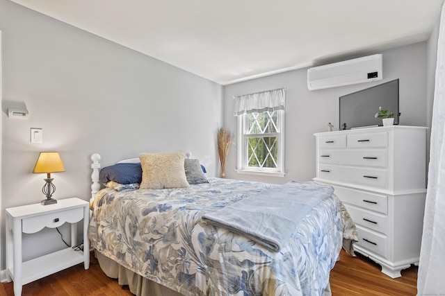 8 Dean Rd, East Lyme, CT 06333 - bedroom with a wall unit AC, wood finished floors, and baseboards