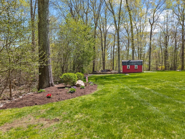 8 Dean Rd, East Lyme, CT 06333 - view of grassy yard featuring an outdoor structure and a storage unit