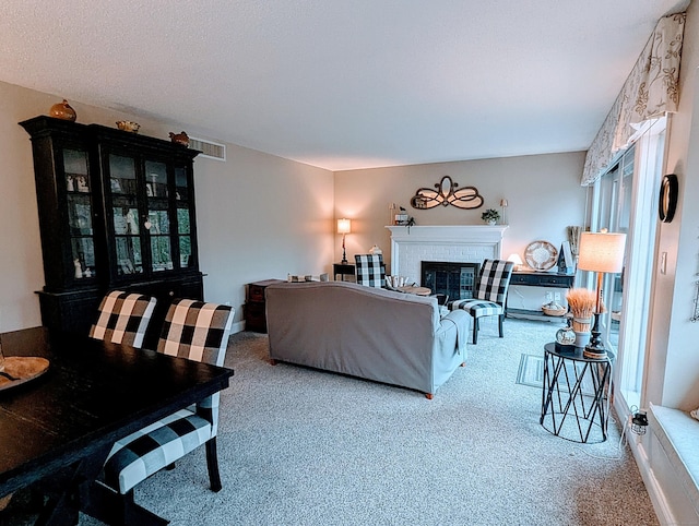 374 Heritage Vlg Unit C, Southbury, CT 06488 - carpeted living room featuring a brick fireplace and visible vents