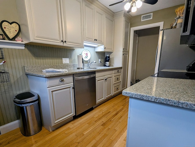 374 Heritage Vlg Unit C, Southbury, CT 06488 - kitchen with a ceiling fan, visible vents, a sink, light wood-style floors, and stainless steel appliances