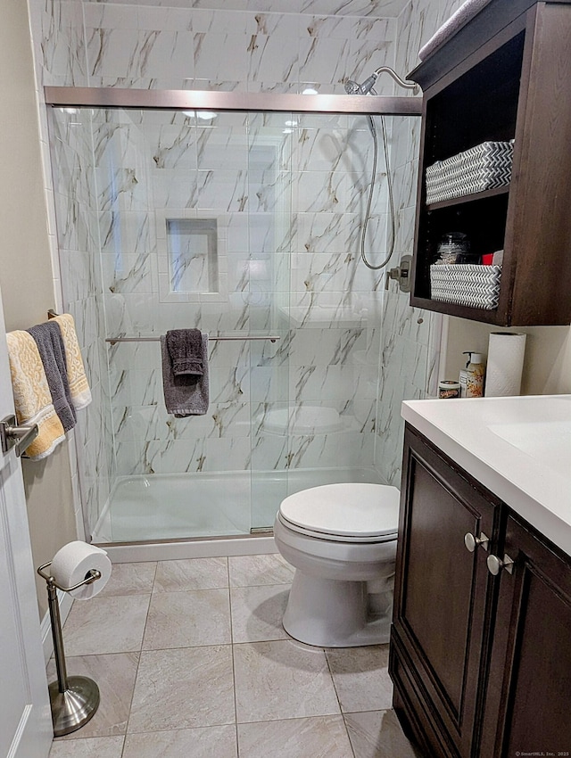374 Heritage Vlg Unit C, Southbury, CT 06488 - bathroom featuring toilet, a marble finish shower, marble finish floor, and vanity