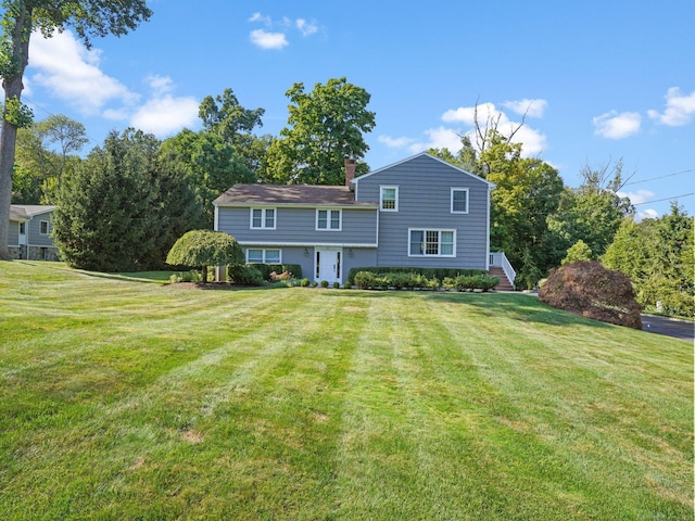 52 Eden Rd, Stamford, CT 06907 - back of house with a chimney and a yard
