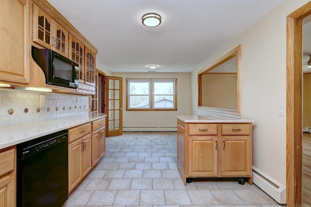 kitchen featuring decorative backsplash, a baseboard radiator, a baseboard heating unit, light countertops, and black appliances