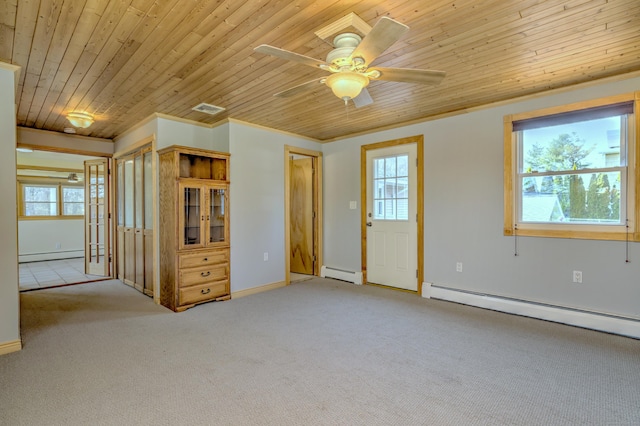 spare room with wood ceiling, a baseboard radiator, baseboard heating, and light carpet
