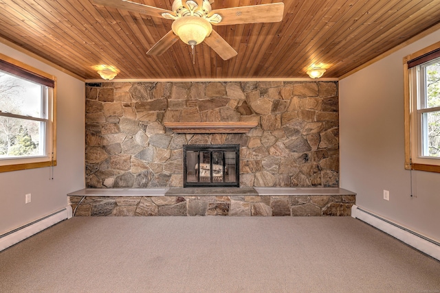 unfurnished living room featuring wood ceiling, a baseboard heating unit, and carpet floors