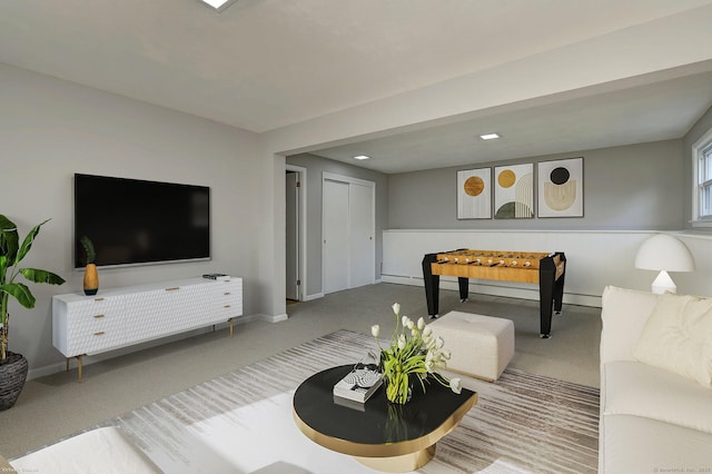 living area with recessed lighting, carpet flooring, baseboard heating, and baseboards