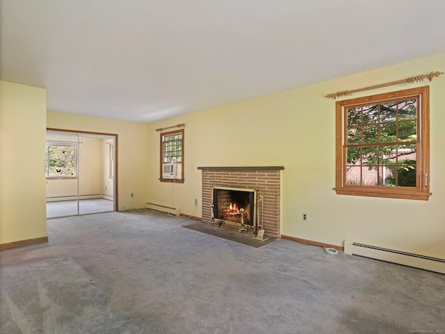 unfurnished living room featuring a baseboard radiator, a fireplace, and carpet floors