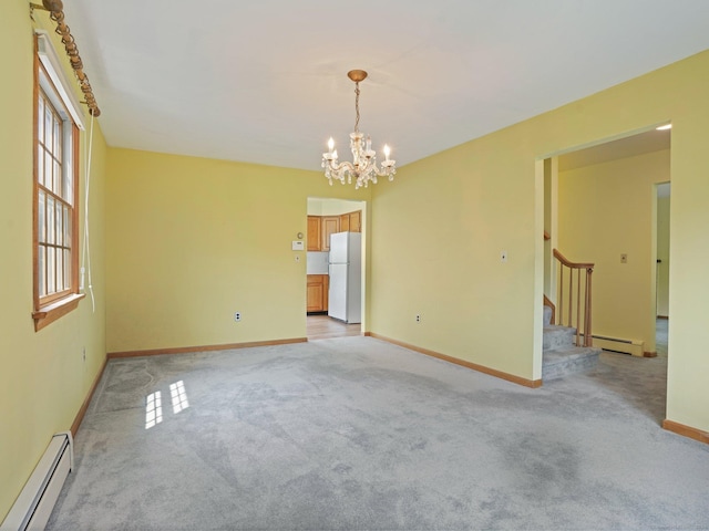 spare room with light carpet, stairs, a baseboard heating unit, and a chandelier