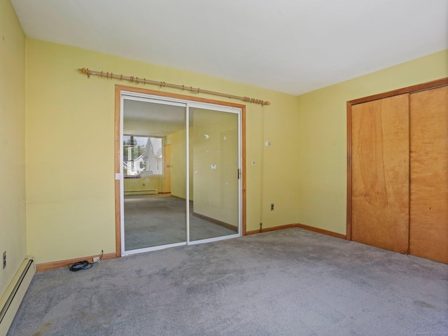 unfurnished bedroom featuring a baseboard radiator, carpet, baseboards, and a baseboard heating unit