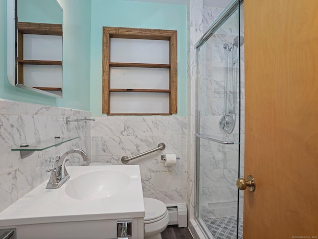 bathroom with toilet, a baseboard heating unit, vanity, and a marble finish shower