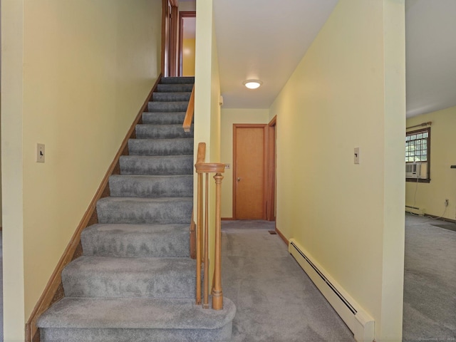 stairway with a baseboard radiator, carpet flooring, baseboards, and cooling unit
