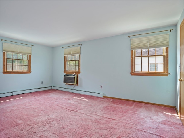 empty room with a baseboard radiator, carpet floors, an AC wall unit, and baseboards
