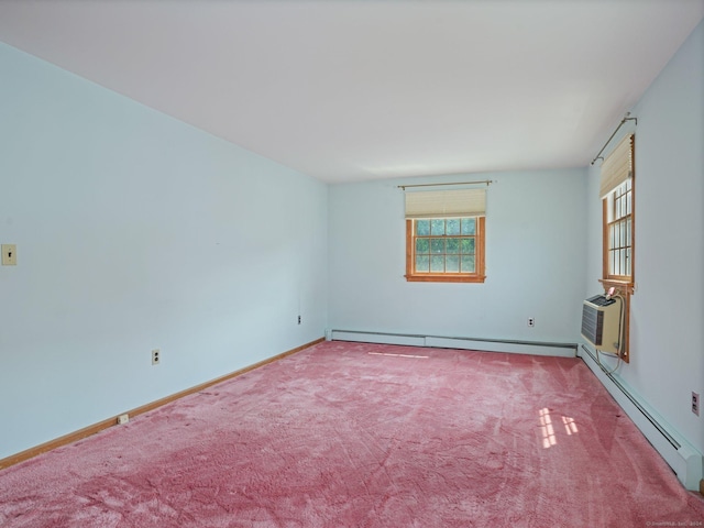 spare room with a wall mounted AC, carpet flooring, and a baseboard heating unit