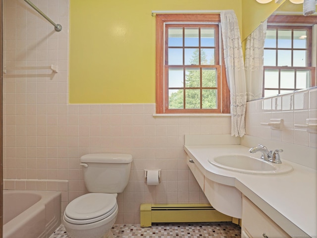 bathroom featuring vanity, tile walls, toilet, a baseboard radiator, and wainscoting