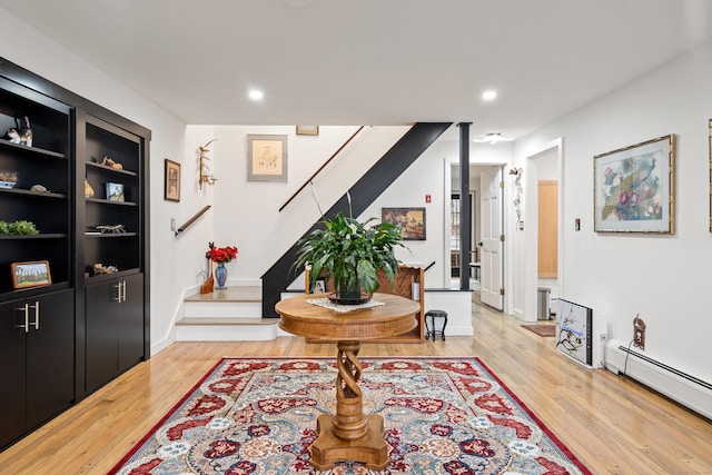162 Hattertown Rd, Newtown, CT 06470 - entryway featuring stairway, light wood-style flooring, a baseboard radiator, and recessed lighting