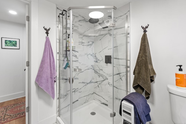 162 Hattertown Rd, Newtown, CT 06470 - bathroom featuring a marble finish shower, toilet, wood finished floors, and baseboards