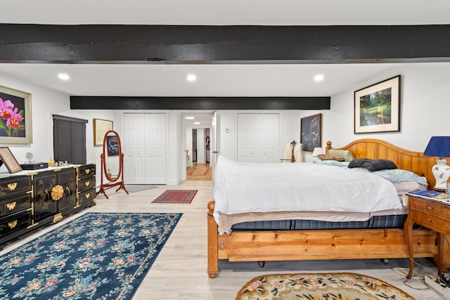 162 Hattertown Rd, Newtown, CT 06470 - bedroom featuring multiple closets, beam ceiling, light wood finished floors, and recessed lighting