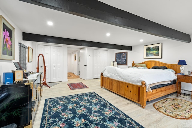 162 Hattertown Rd, Newtown, CT 06470 - bedroom with two closets, light wood-style floors, beamed ceiling, recessed lighting, and baseboard heating