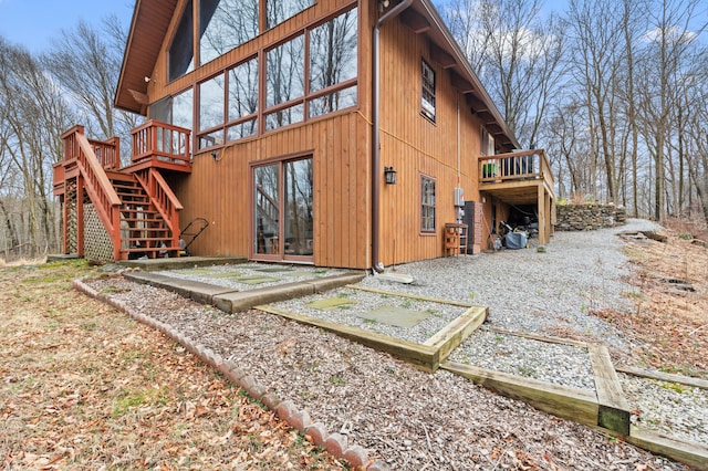 162 Hattertown Rd, Newtown, CT 06470 - back of property with a deck, stairway, and a patio area