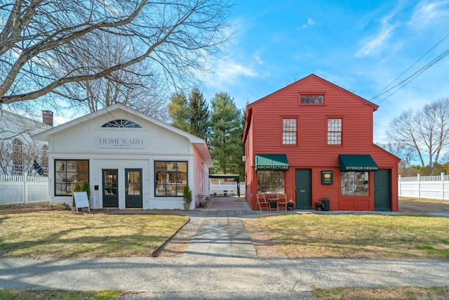 24-26 Lyme St, Old Lyme, CT 06371 - view of front of home with fence and a front lawn