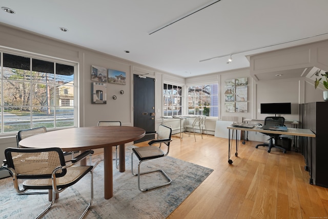 24-26 Lyme St, Old Lyme, CT 06371 - dining space featuring light wood-style flooring and baseboard heating