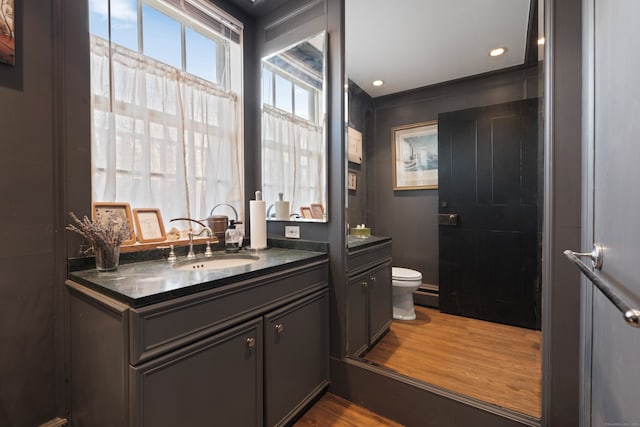 24-26 Lyme St, Old Lyme, CT 06371 - bathroom with recessed lighting, wood finished floors, toilet, and vanity