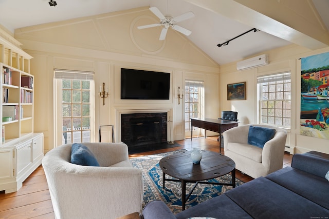 24-26 Lyme St, Old Lyme, CT 06371 - living room featuring a wall mounted AC, plenty of natural light, a ceiling fan, and light wood finished floors