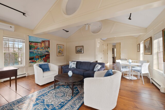 24-26 Lyme St, Old Lyme, CT 06371 - living room featuring wood-type flooring, vaulted ceiling with beams, an AC wall unit, and a baseboard heating unit