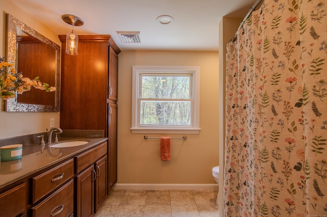 bathroom with visible vents, vanity, baseboards, toilet, and a shower with shower curtain