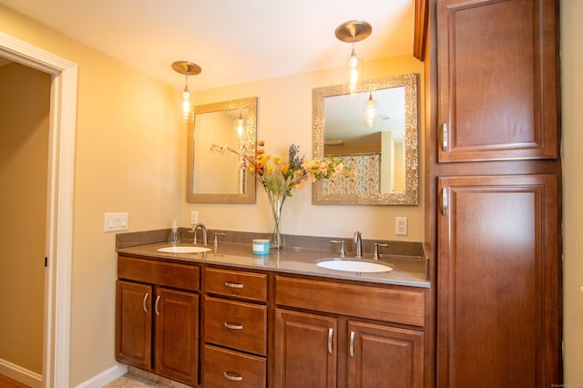 full bath featuring double vanity and a sink