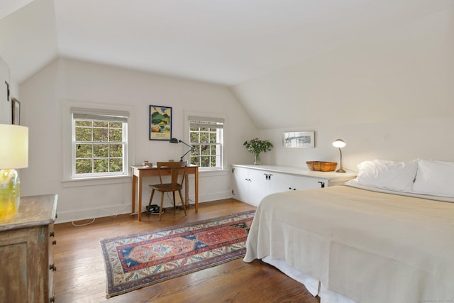 167 Skunk Ln, Wilton, CT 06897 - bedroom with lofted ceiling, wood finished floors, and baseboards