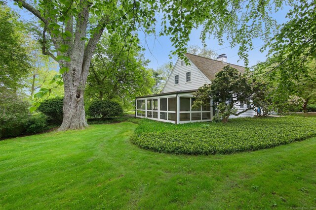 167 Skunk Ln, Wilton, CT 06897 - view of green lawn with a sunroom