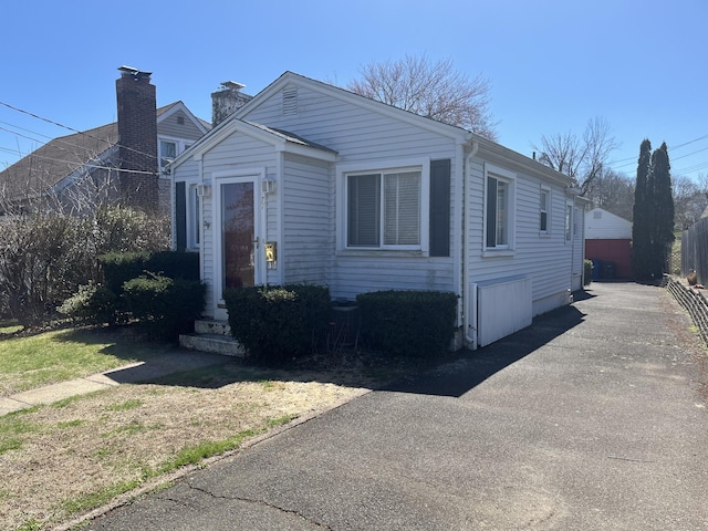 view of front of property with a detached garage