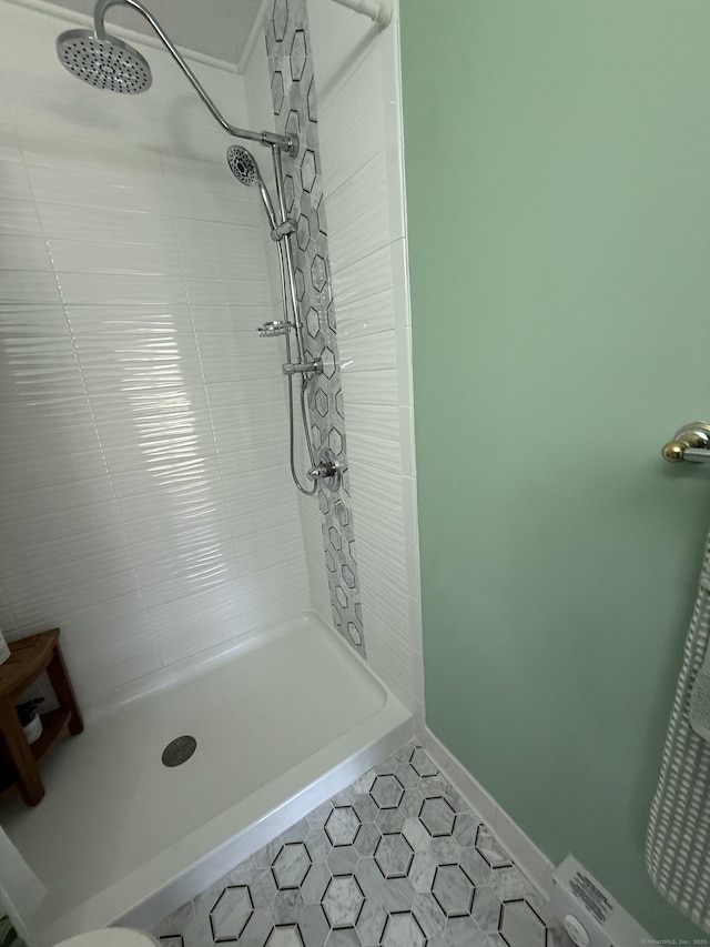 15 Pilgrim Hbr Unit A, Wallingford, CT 06492 - bathroom featuring a tile shower, tile patterned flooring, and baseboards