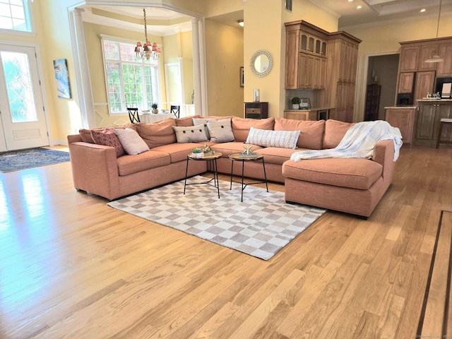 21 Autumn Cir, Rocky Hill, CT 06067 - living area featuring a chandelier, light wood finished floors, and ornamental molding