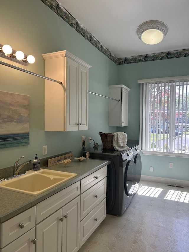 21 Autumn Cir, Rocky Hill, CT 06067 - laundry area with cabinet space, separate washer and dryer, baseboards, and light tile patterned floors